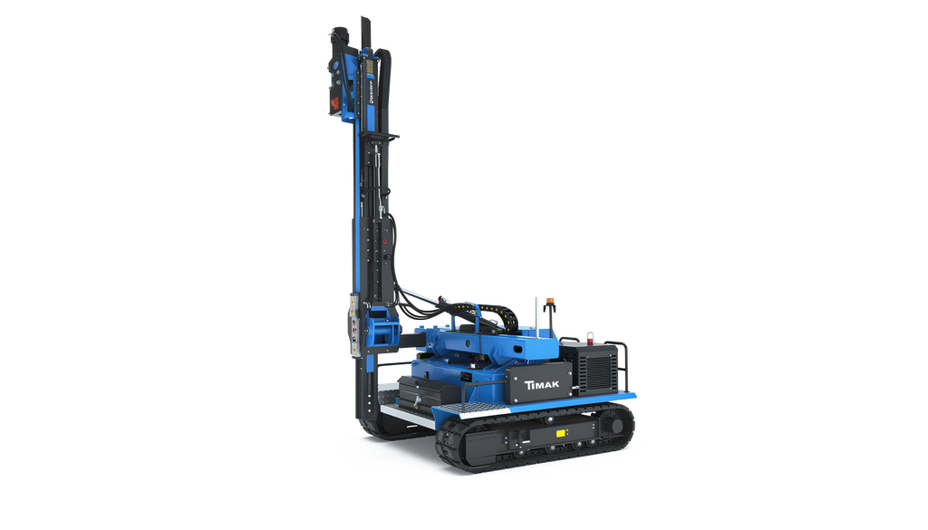 A blue and black drilling rig, a type of heavy equipment used for drilling holes in the ground, set against a solid black background.