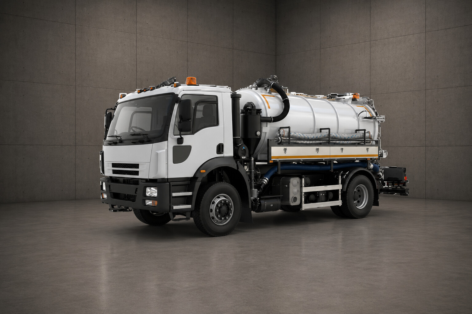 A white tanker truck with a large tank and hose is parked in a gray room, likely used for transporting and dispensing liquids.