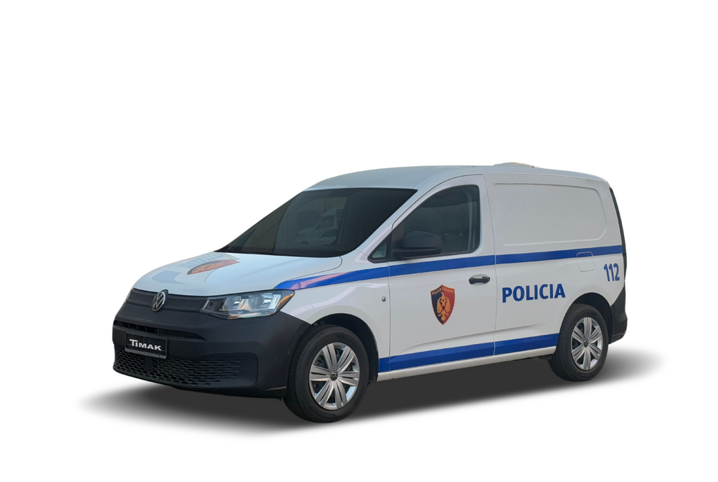 A white police van with blue stripes and the word "POLICIA" emblazoned on the side, set against a stark black background.
